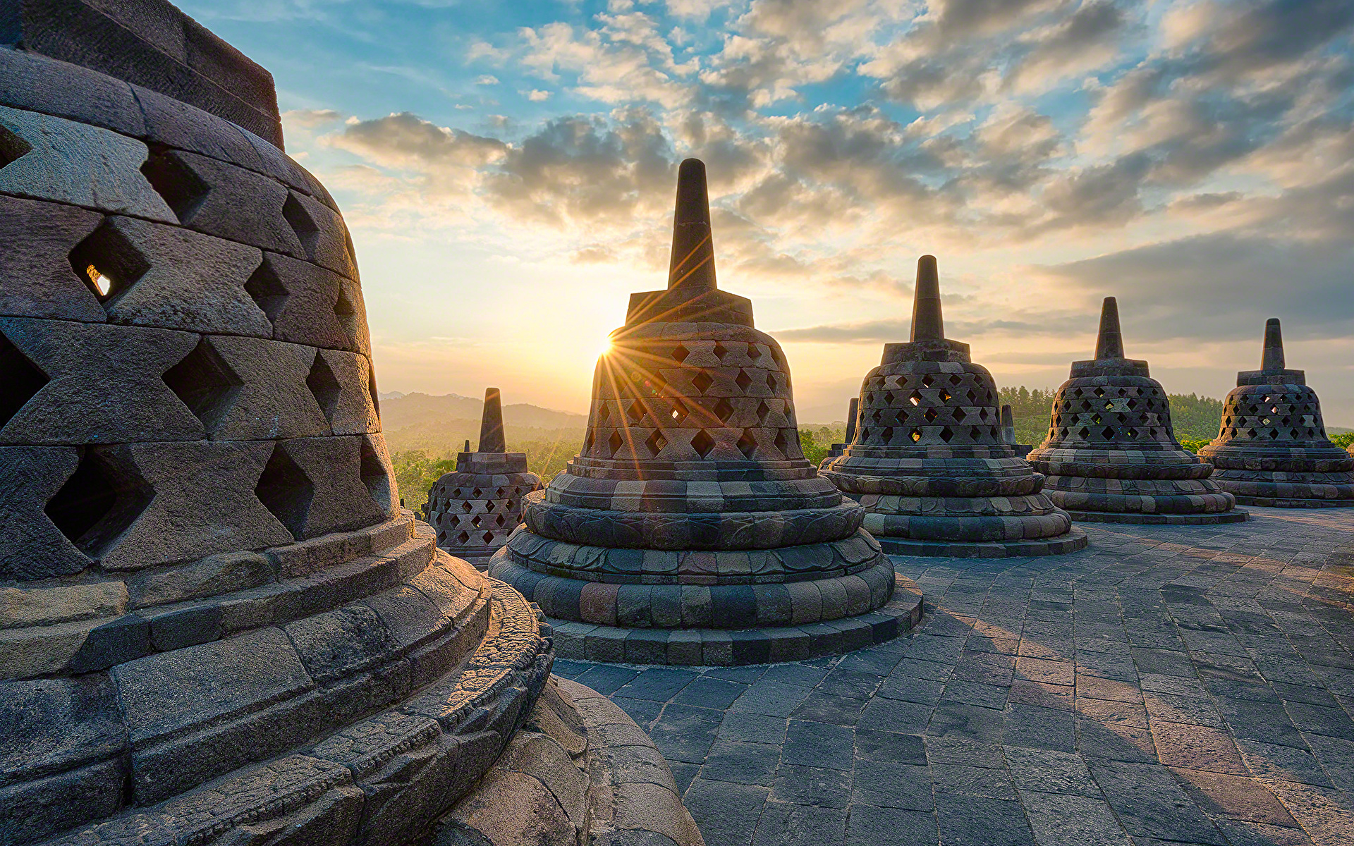 Borobudur, buddha in stupa with stupas and surrounding in background, at  dawn with soft clouds. Sepia color Stock Photo - Alamy