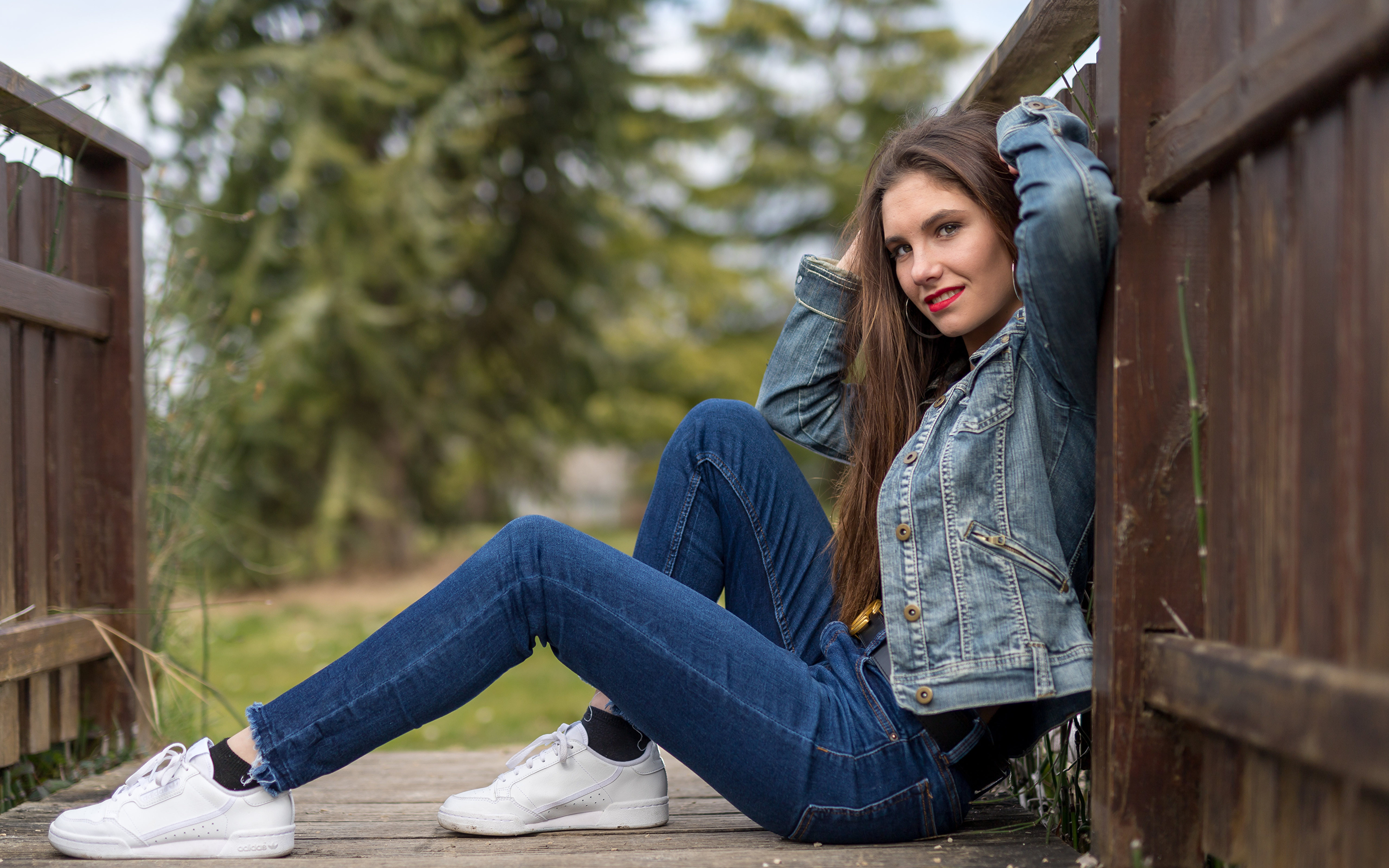 Beautiful Stylish Young Woman In A Trendy Denim Jacket Poses Outdoor Stock  Photo, Picture and Royalty Free Image. Image 107589748.