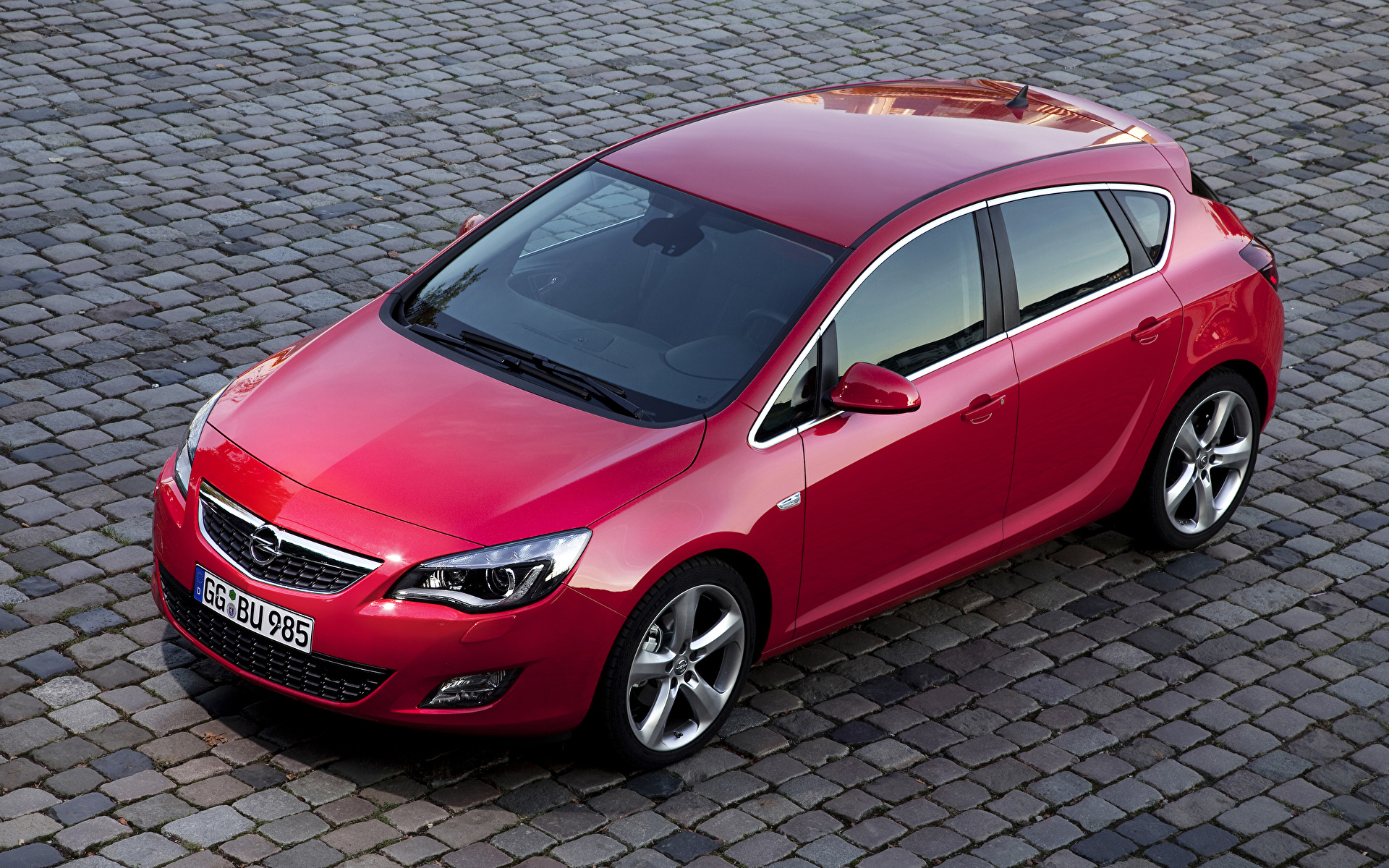 Фотографии Opel 2009-12 Astra красных Металлик Автомобили 1920x1200