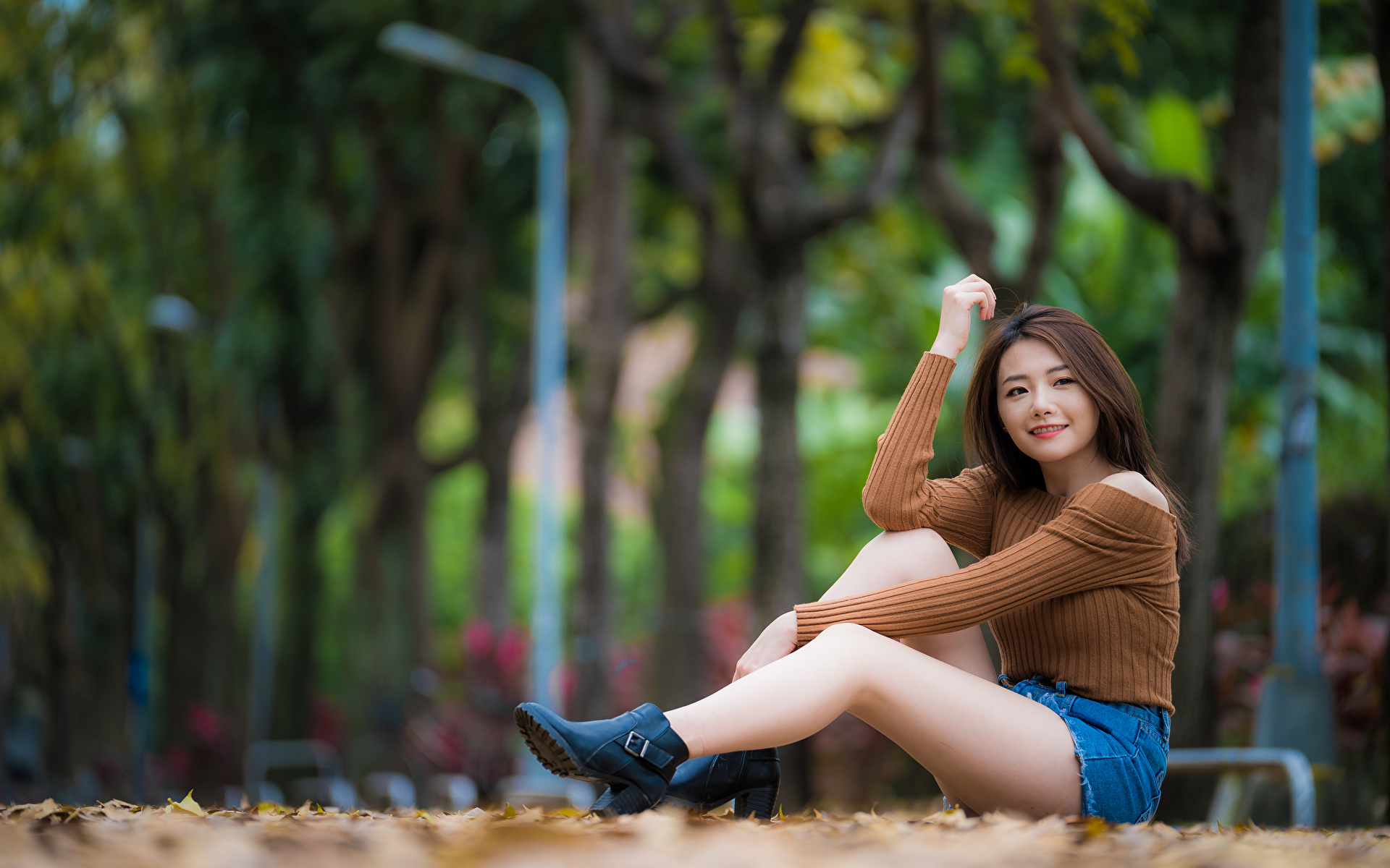 Picture Bokeh young woman Legs Asian Sweater sit Shorts 1920x1200