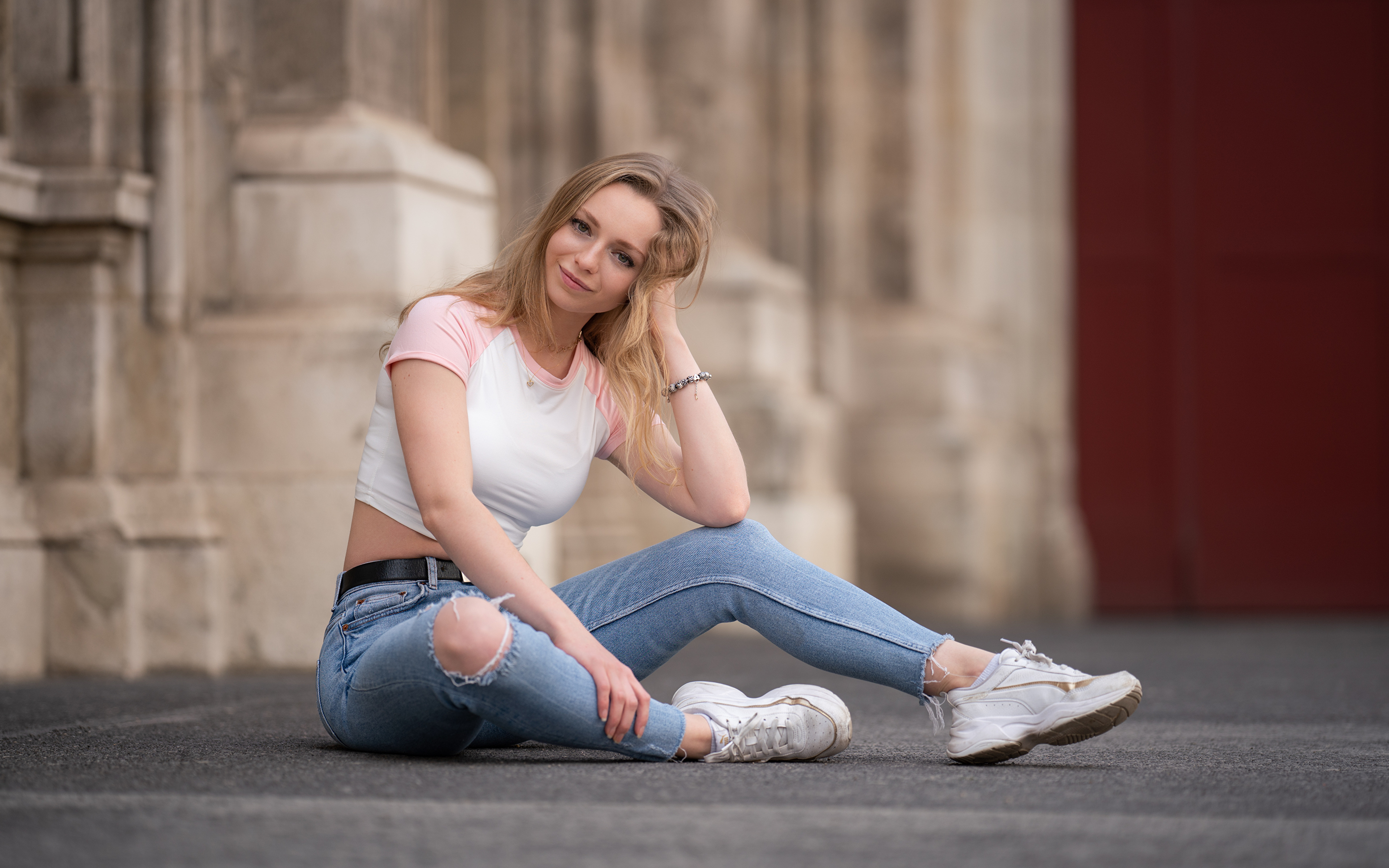 A woman in black shirt and jeans posing for a picture photo – Free Female  Image on Unsplash