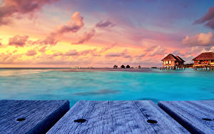 Sfondi desktop Maldive Tropici Alba e tramonto Bungalow Tavole