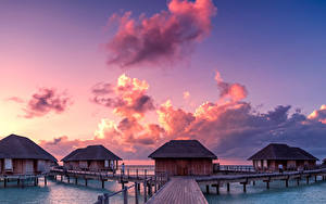 Sfondi desktop Maldive Tropici Alba e tramonto Ponti Cielo Bungalow Nubi Natura