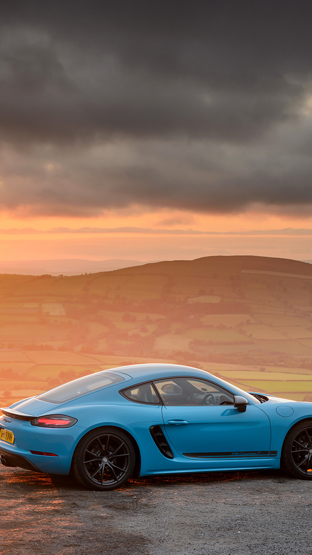 Картинка Porsche 718 Cayman рассвет и закат Сбоку машина 1080x1920