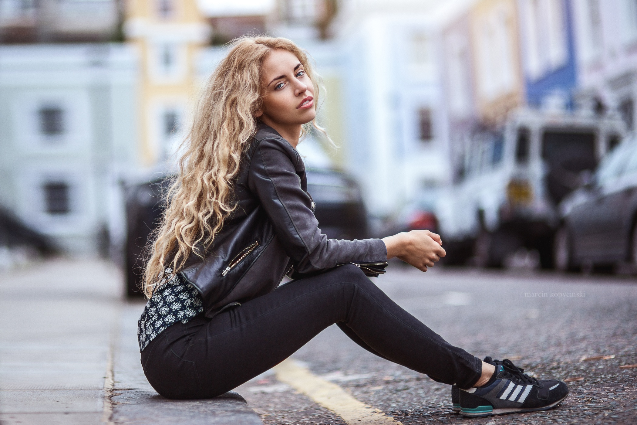 Pictures Blonde girl Bokeh Girls Jacket Legs Side Sitting 2100x1400