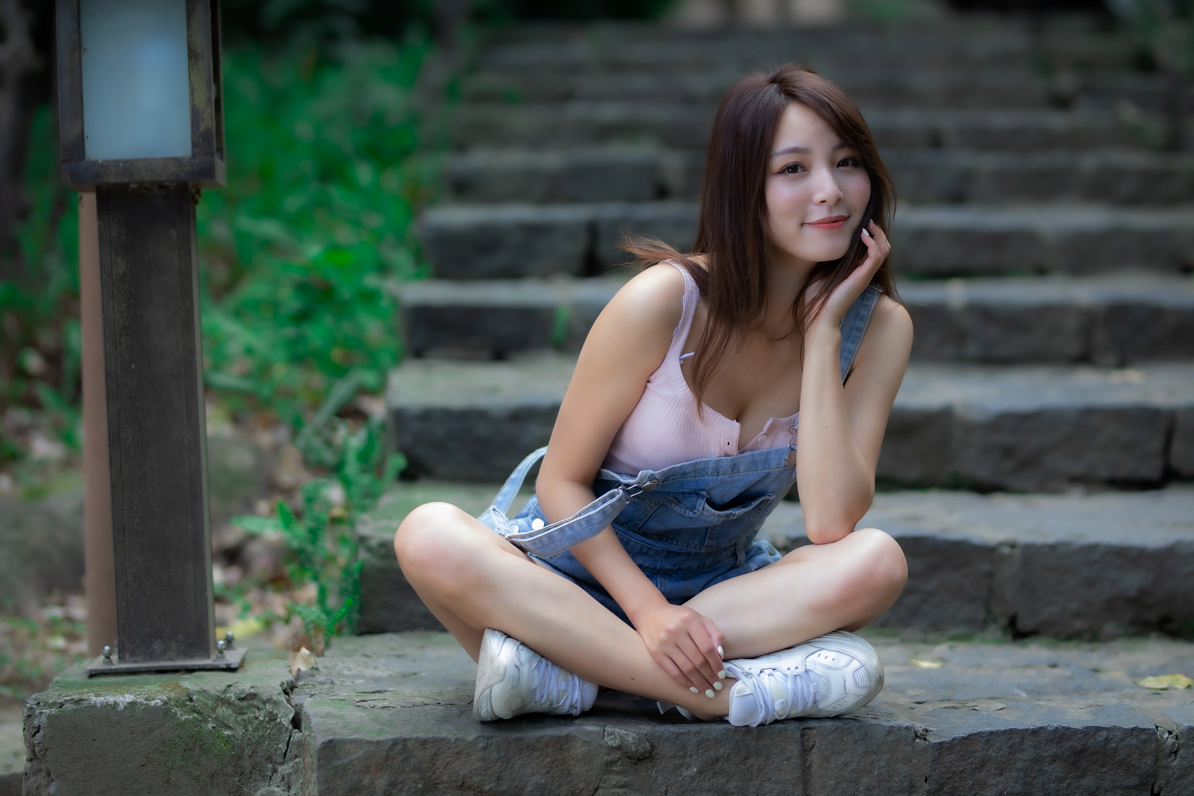 Young cute pensive caucasian girl posing in white shirt, blue jeans at  studio Stock Photo by ©artem-zacepilin@yandex.ru 396457408
