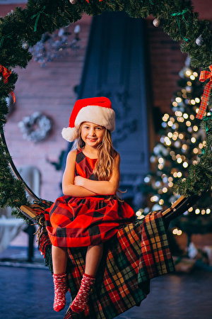 Wallpapers New year Little girls Sit Winter hat Smile